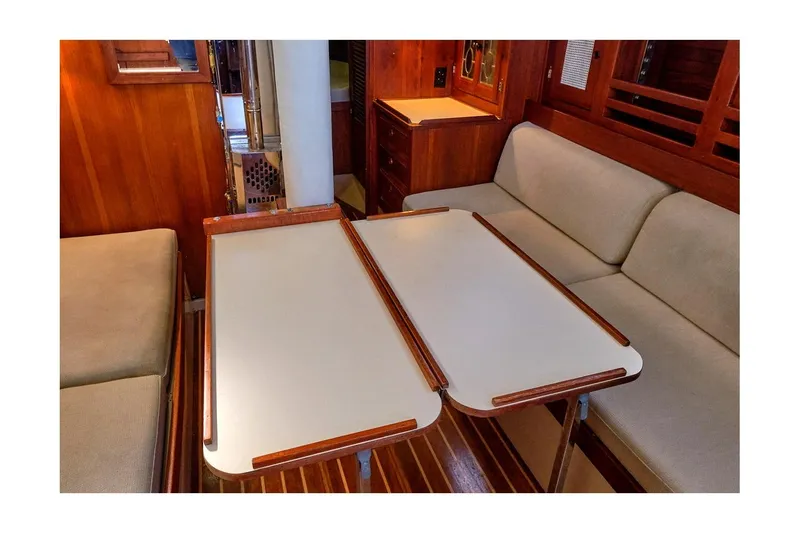 Slide: The Image of Interior of 1981 CAL 39 MK III sailboat with foldable table and cushioned seating. - 47
