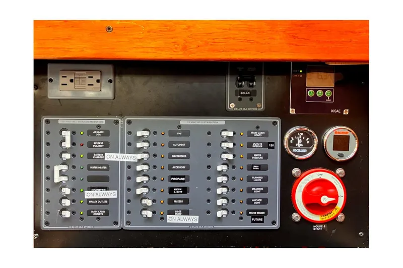 Slide: The Image of Control panel of a 1981 Jensen Marine/Cal Boats 39 MK III, featuring switches and gauges. - 57