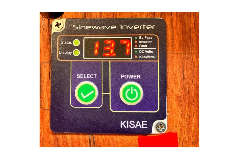 Slide: The Image of KISAE sinewave inverter display showing 13.7 volts on a Jensen Marine/Cal Boats 1981 model. - 58