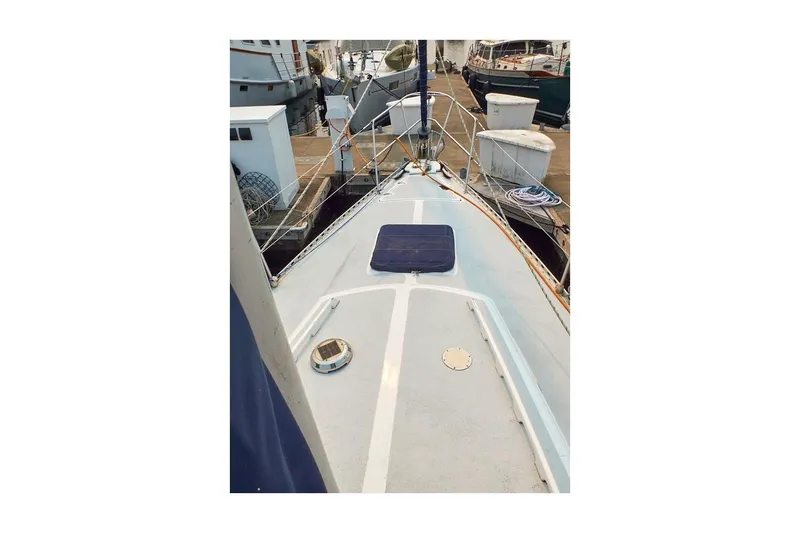 Slide: The Image of 1981 Jensen Marine/Cal Boats 39 MK III sailboat deck view at marina. - 6