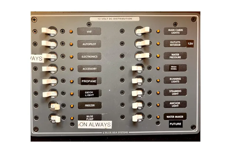 Slide: The Image of Electrical panel of 1981 Jensen Marine/Cal Boats 39 MK III with labeled switches. - 60
