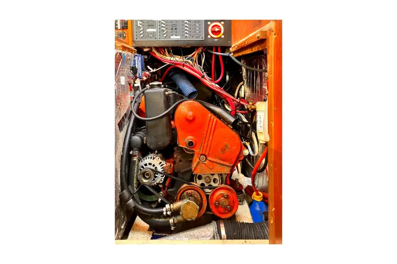 Slide: The Image of Engine compartment of 1981 Jensen Marine/Cal Boats 39 MK III, showcasing wiring and components. - 61