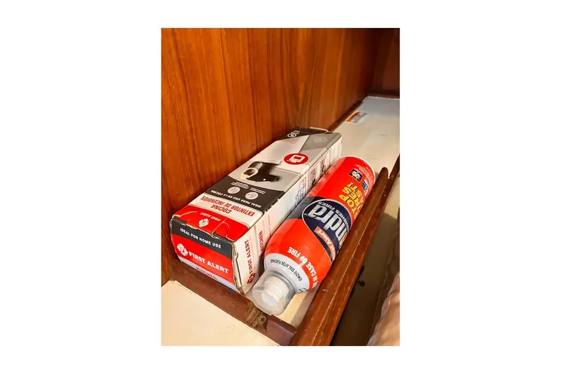 Slide: The Image of Safety equipment stored in a 1981 Jensen Marine/Cal Boats 39 MK III cabin. - 66