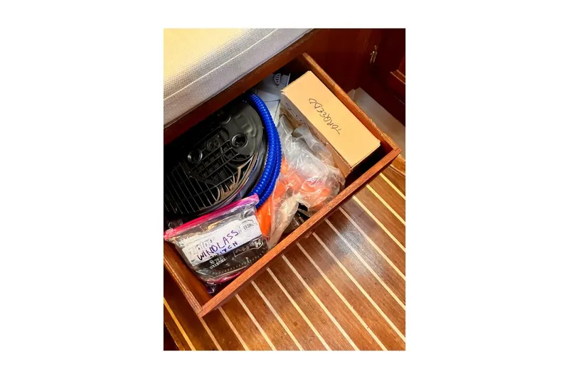 Slide: The Image of Storage compartment on 1981 Jensen Marine/Cal Boats 39 MK III with boating accessories. - 72