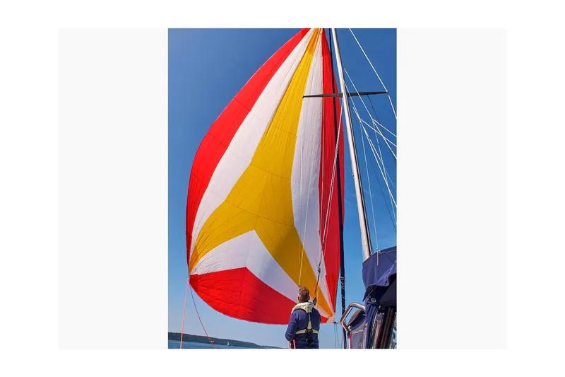 Slide: The Image of Sailboat with colorful spinnaker sail, Jensen Marine/Cal Boats 39 MK III, 1981 model. - 81