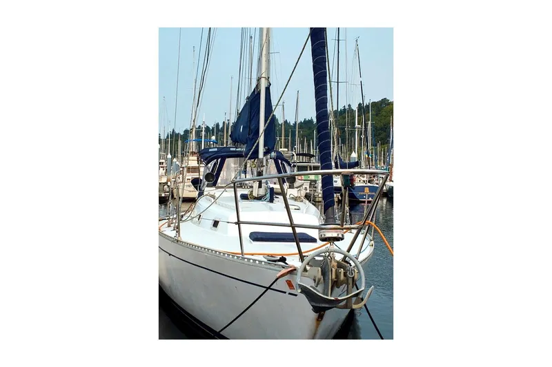 Slide: The Image of 1981 Jensen Marine/Cal Boats 39 MK III sailboat docked in a marina. - 9