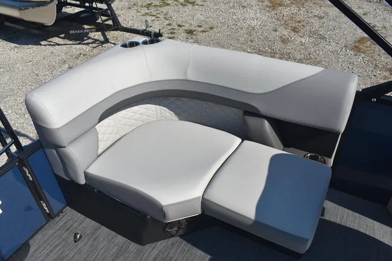 Slide: The Image of Luxurious seating on 2026 Lowe SS 230 WV boat, featuring elegant gray upholstery and cup holders. - 11