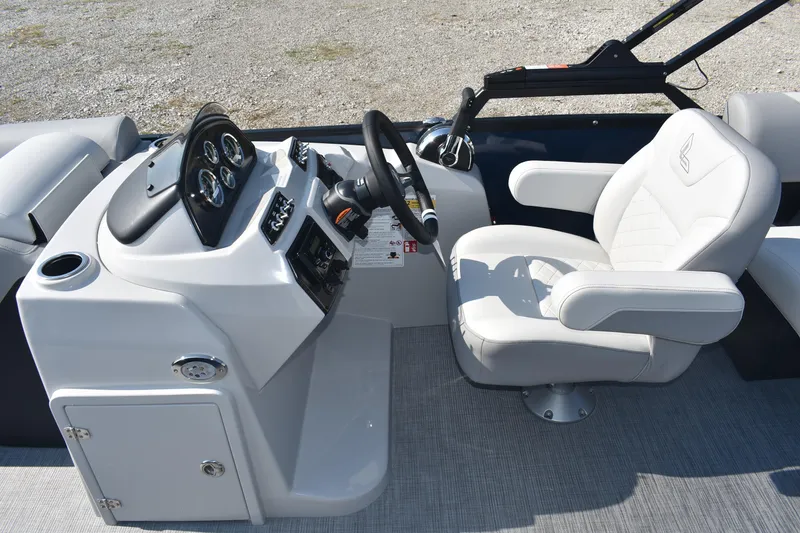 Slide: The Image of 2026 Lowe SS 230 WV boat helm with steering wheel and cushioned captain's chair. - 14