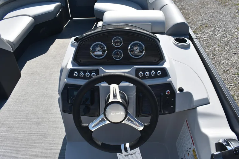 Slide: The Image of Steering console of 2026 Lowe SS 230 WV boat with modern gauges and controls. - 15