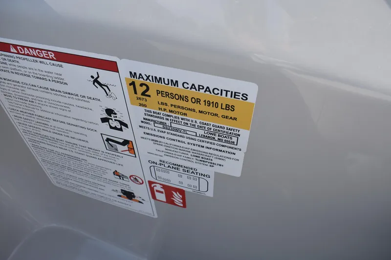 Slide: The Image of Safety and capacity labels on 2026 Lowe SS 230 WV boat, indicating 12-person limit. - 16