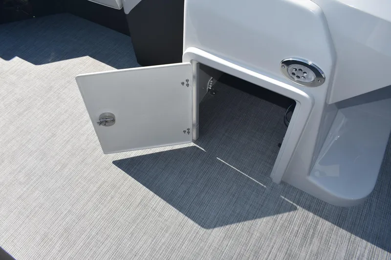 Slide: The Image of Open storage compartment on 2026 Lowe SS 230 WV boat deck. - 17