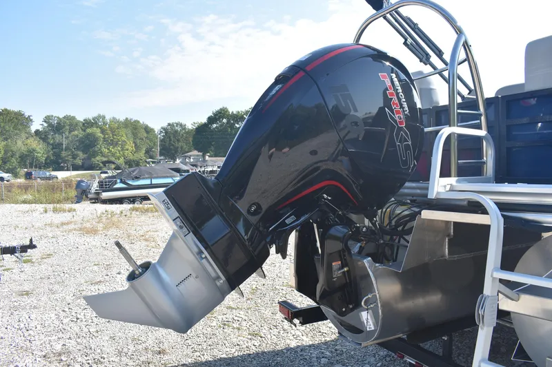 Slide: The Image of 2026 Lowe SS 230 WV boat with Mercury Pro XS outboard motor, parked on gravel. - 5