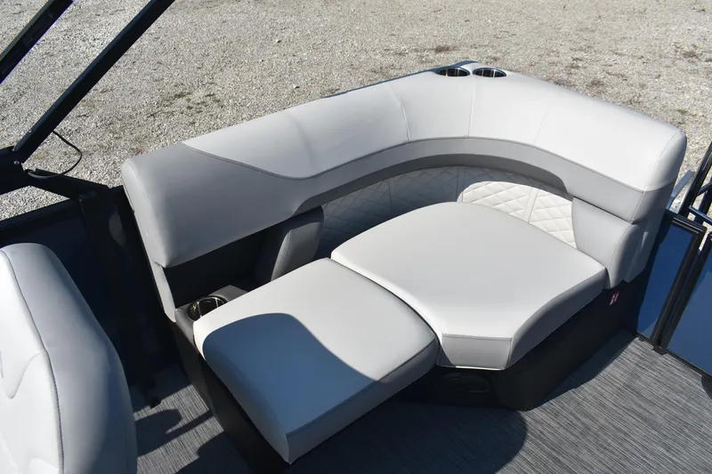Slide: The Image of 2026 Lowe SS 230 WV boat interior with plush seating and cup holders. - 9