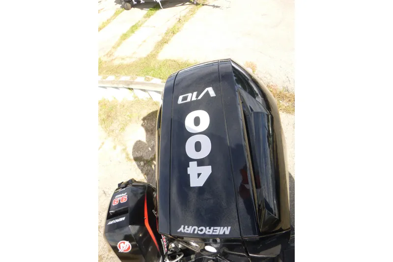 Slide: The Image of ```json { "alt_text": "2023 Nitro ZV21 with Mercury 400 outboard engine, top view." } ``` - 12