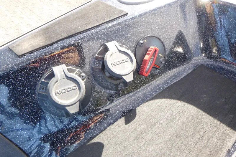 Slide: The Image of 2023 Nitro ZV21 boat dashboard with NOCO power outlets and control switch. - 16