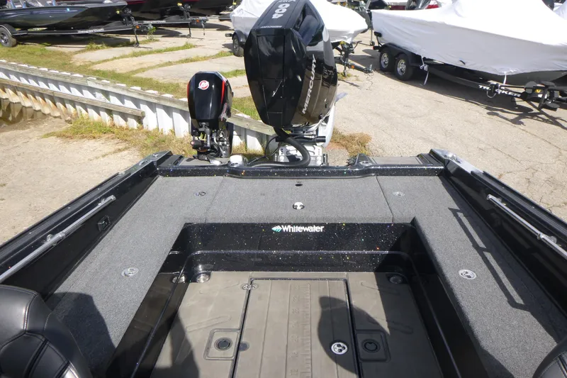 Slide: The Image of 2023 Nitro ZV21 boat interior with Mercury engine, parked on a trailer. - 17