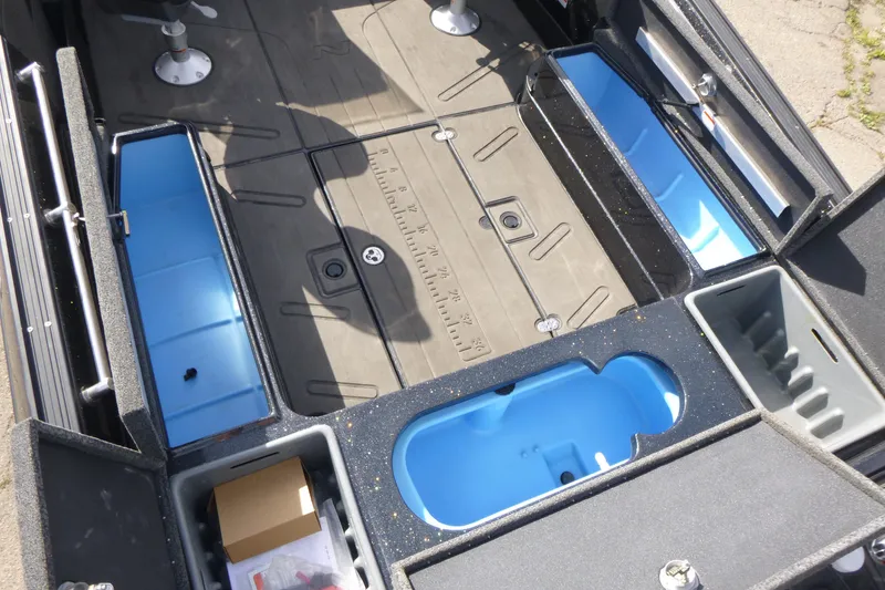 Slide: The Image of 2023 Nitro ZV21 boat interior with storage compartments and seating area. - 18