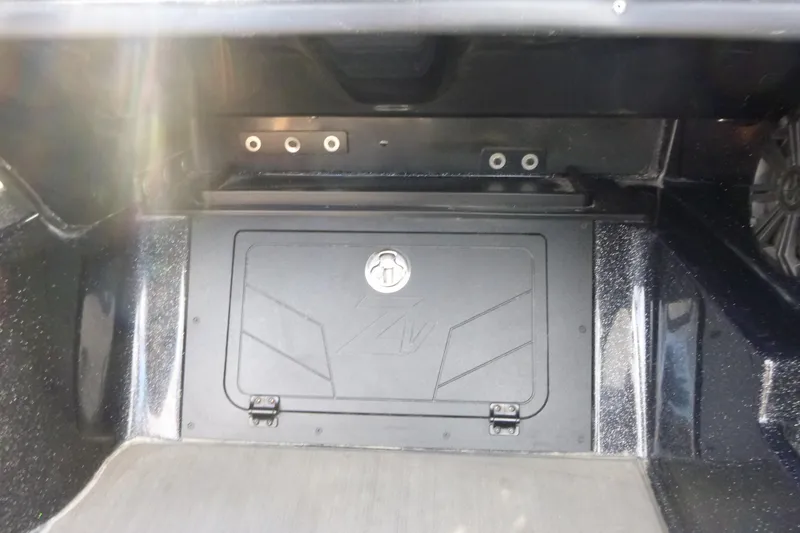 Slide: The Image of 2023 Nitro ZV21 storage compartment with secure lock and sleek design. - 27