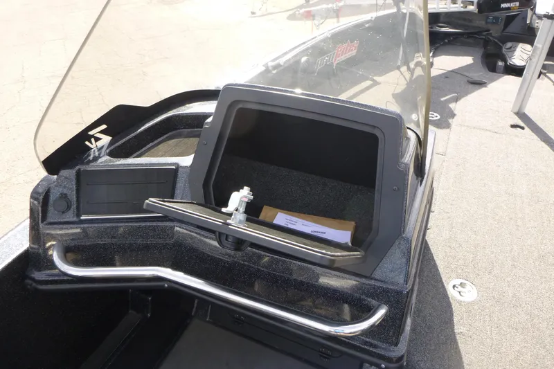 Slide: The Image of 2023 Nitro ZV21 boat dashboard with open storage compartment and windshield. - 29