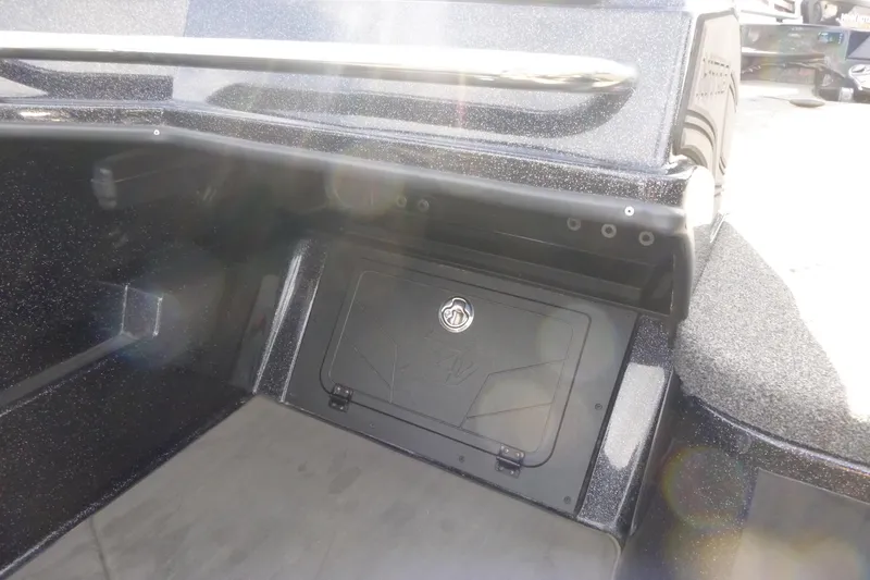 Slide: The Image of 2023 Nitro ZV21 boat storage compartment with sleek design and secure latch. - 30