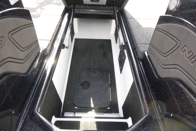 Slide: The Image of 2023 Nitro ZV21 boat storage compartment with open hatch, showcasing spacious interior design. - 32