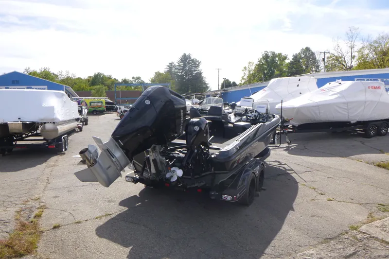 Slide: The Image of 2023 Nitro ZV21 boat on trailer in outdoor storage area. - 6