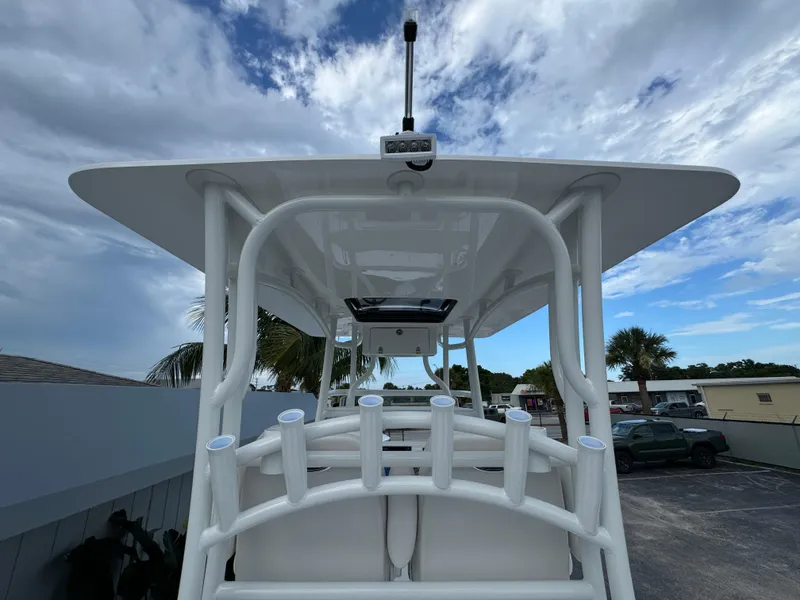 Slide: The Image of Aerial view of 2026 Shallow Sport 25 X3 boat on sandy shore. - 18