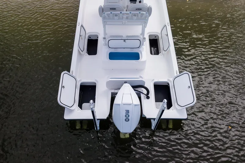 Slide: The Image of 2026 Shallow Sport 25 X3 boat on trailer, featuring Garmin equipment, under cloudy sky. - 2