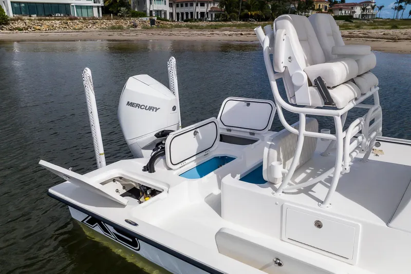 Slide: The Image of 2026 Shallow Sport 25 X3 boat with Garmin equipment, under cloudy sky. - 3