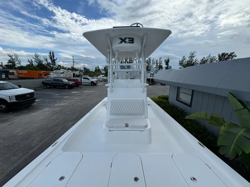 Slide: The Image of 2026 Shallow Sport 25 X3 boat interior with seating and Mercury engine. - 9