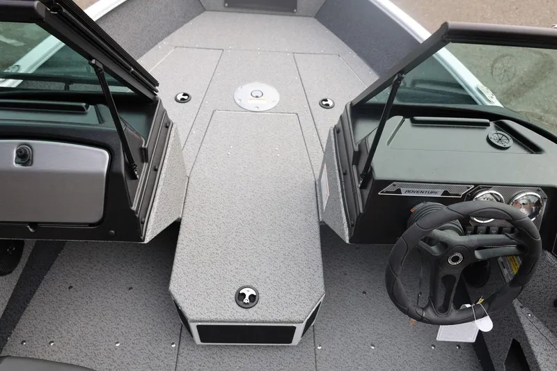 Slide: The Image of 2026 Lund 1775 Adventure Sport boat interior with steering wheel and dashboard. - 34