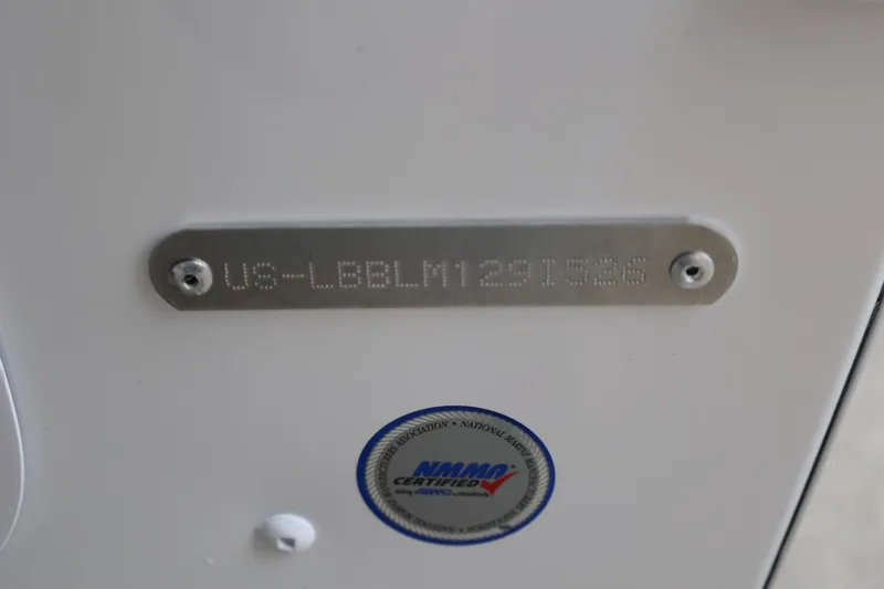 Slide: The Image of 2026 Lund 1775 Adventure Sport boat identification plate with NMMA certification sticker. - 41