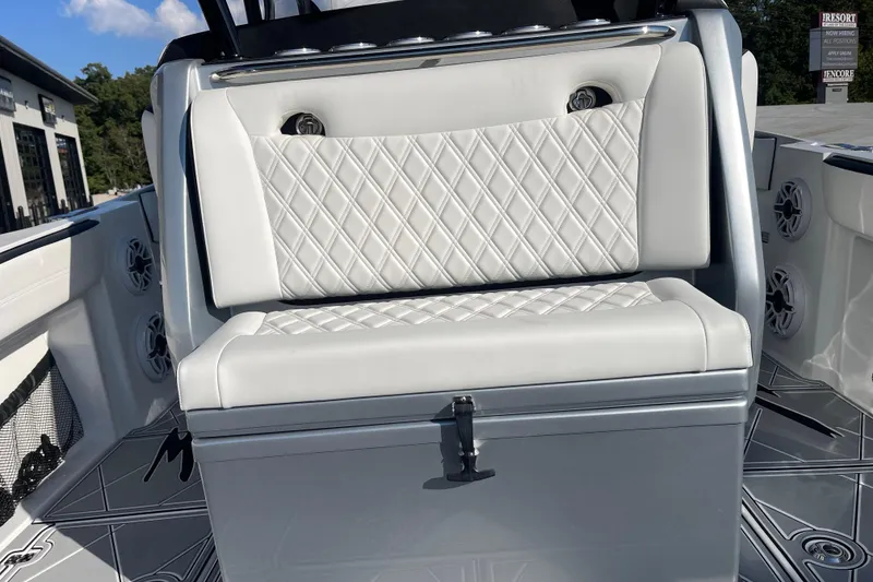 Slide: The Image of 2025 Nor-Tech 340 Sport Center Console with luxurious white diamond-stitched seating. - 12