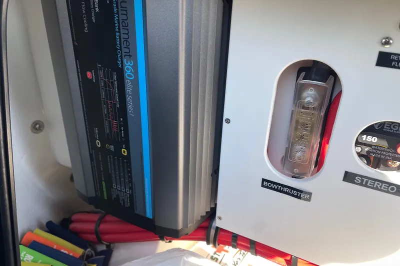 Slide: The Image of 2025 Nor-Tech 340 Sport Center Console marine battery charger and bow thruster controls. - 16