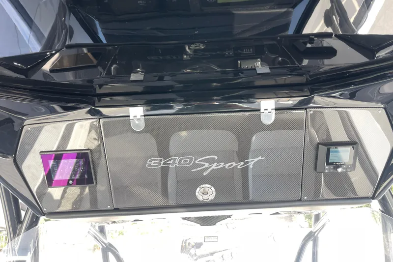 Slide: The Image of 2025 Nor-Tech 340 Sport Center Console dashboard with sleek design and modern controls. - 18