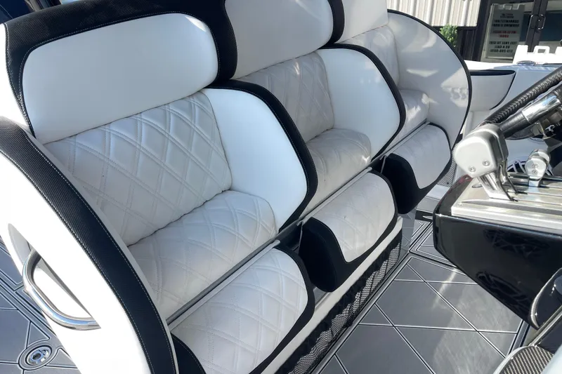 Slide: The Image of 2025 Nor-Tech 340 Sport Center Console with luxurious white quilted seating. - 19