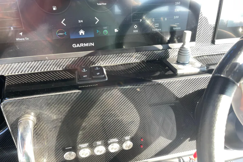 Slide: The Image of Dashboard of 2025 Nor-Tech 340 Sport Center Console with Garmin navigation system. - 21