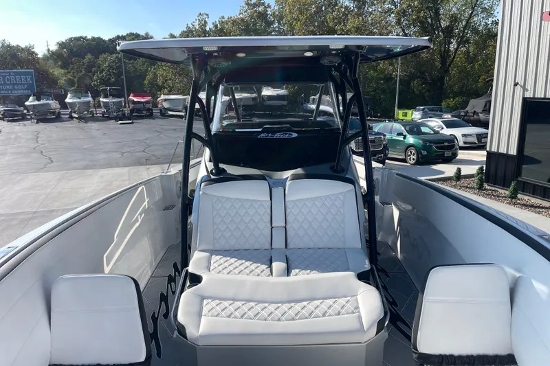 Slide: The Image of 2025 Nor-Tech 340 Sport Center Console boat with luxurious seating and sleek design. - 24
