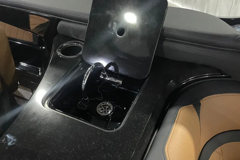 Slide: The Image of 2026 Yamaha Boats 275SD interior with sleek black sink and luxurious seating. - 6