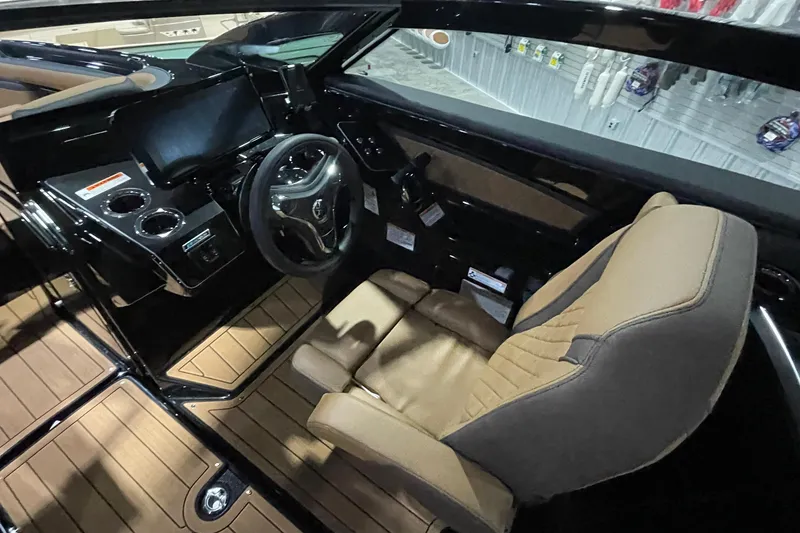 Slide: The Image of 2026 Yamaha Boats 275SD cockpit with modern steering and luxurious seating. - 8