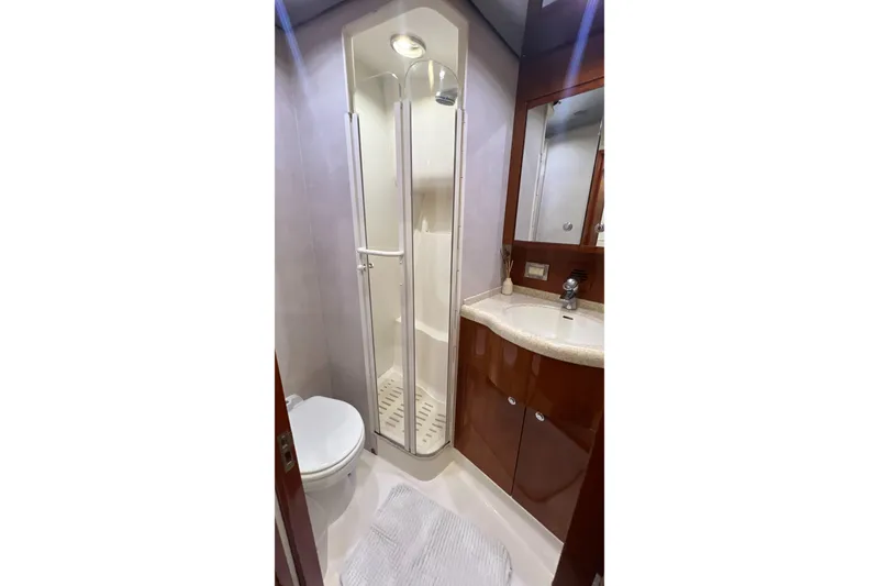 Slide: The Image of Luxurious bathroom in 2005 Bertram 450 yacht with shower, sink, and toilet. - 15