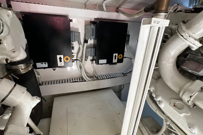 Slide: The Image of Engine room of a 2005 Bertram 450 yacht with electrical components and wiring. - 24