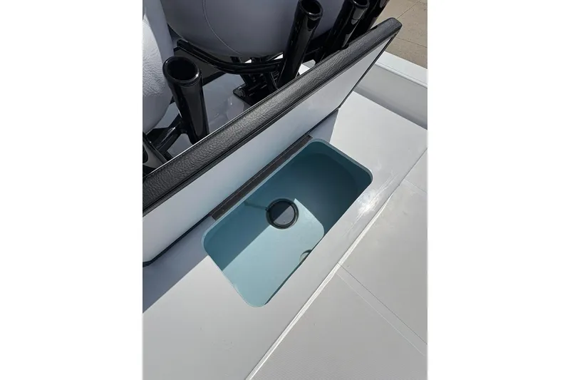 Slide: The Image of 2026 Mamba 24 Cat Elite boat interior with open storage compartment. - 11