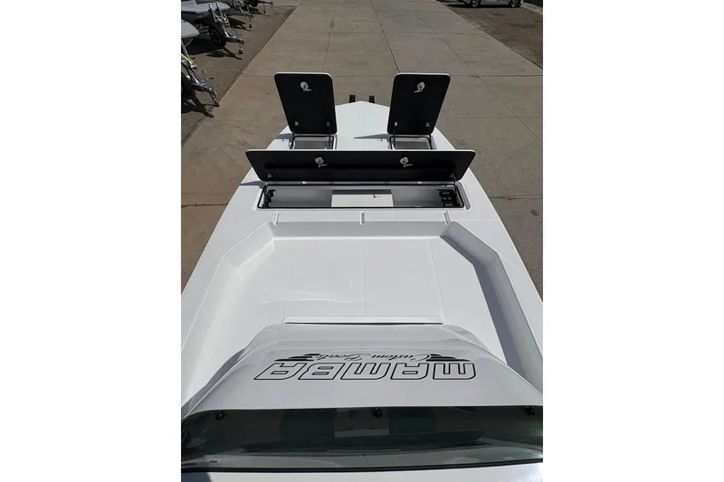 Slide: The Image of 2026 Mamba 24 Cat Elite boat with open storage compartments on deck. - 12