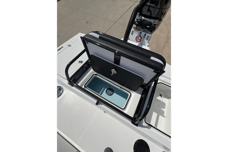 Slide: The Image of 2026 Mamba 24 Cat Elite boat with open storage compartment and engine view. - 14
