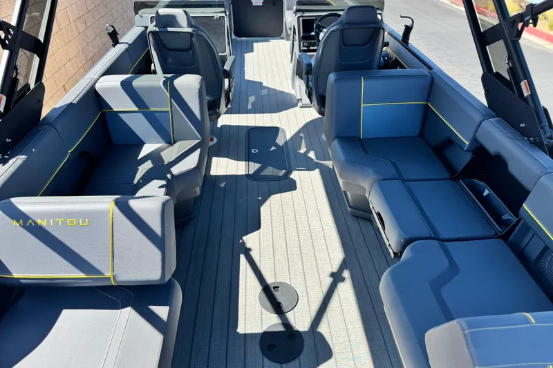 Slide: The Image of Interior of 2025 Manitou EXPLORE 24 boat with modern seating and sleek design. - 20