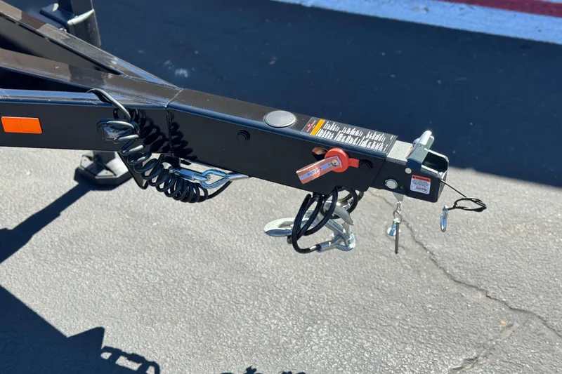 Slide: The Image of Trailer hitch of 2025 Manitou EXPLORE 24 on asphalt surface. - 26