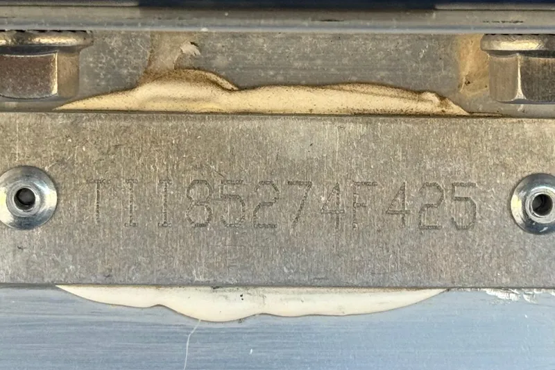 Slide: The Image of Close-up of a metal plate with engraved serial number on a 2025 Manitou EXPLORE 24. - 28