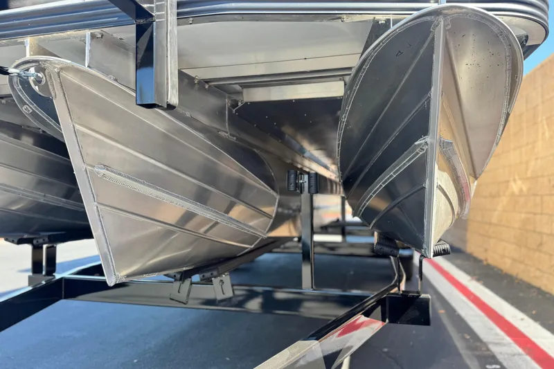 Slide: The Image of Underneath view of 2025 Manitou EXPLORE 24 pontoon boat, showcasing aluminum hull design. - 4