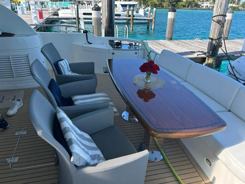 Slide: The Image of Luxury yacht deck with elegant seating and table, Marquis 65, 2006 model. - 14